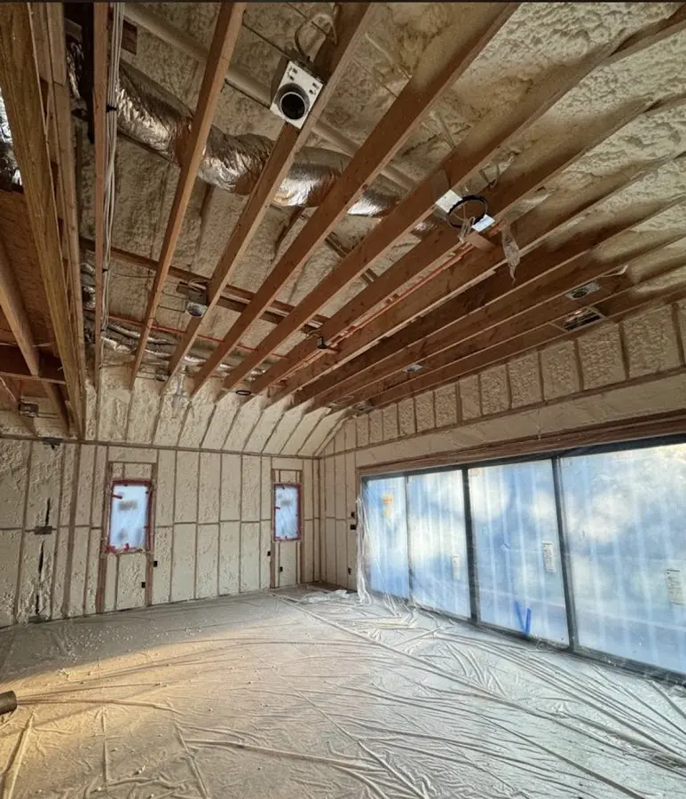 Interior walls and ceiling insulated with spray foam during new construction in Miami Shores